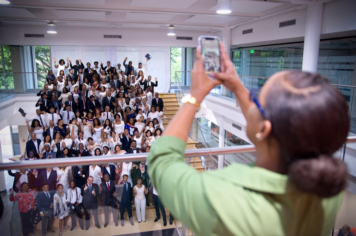 Graduating class photographed together on the campus staircase